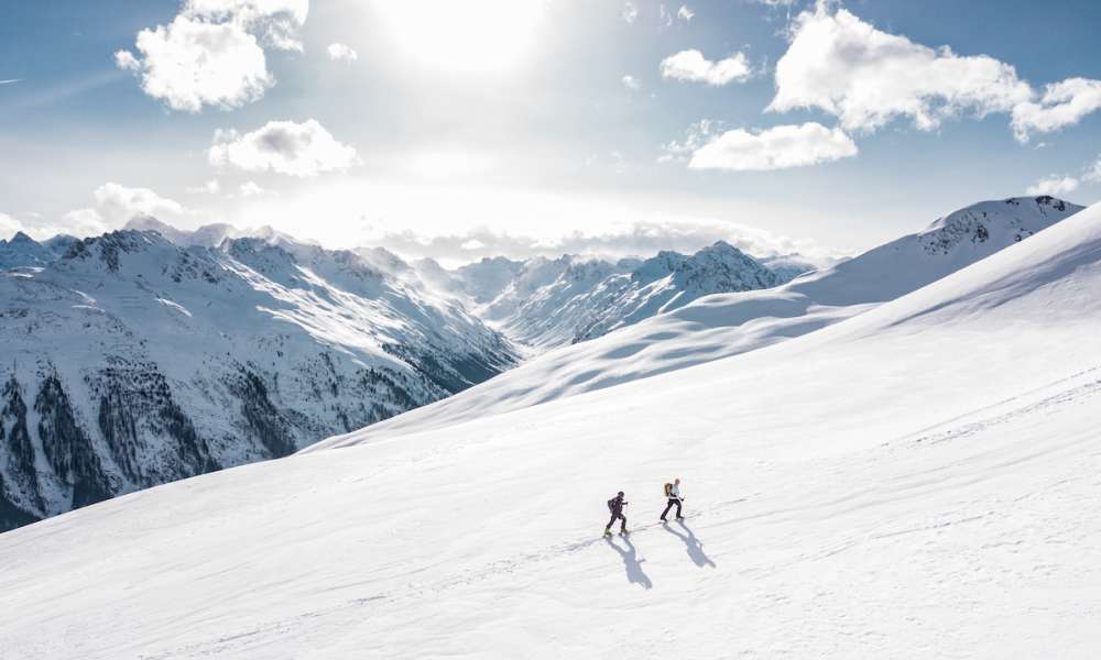 Two men hiking on snow mountain