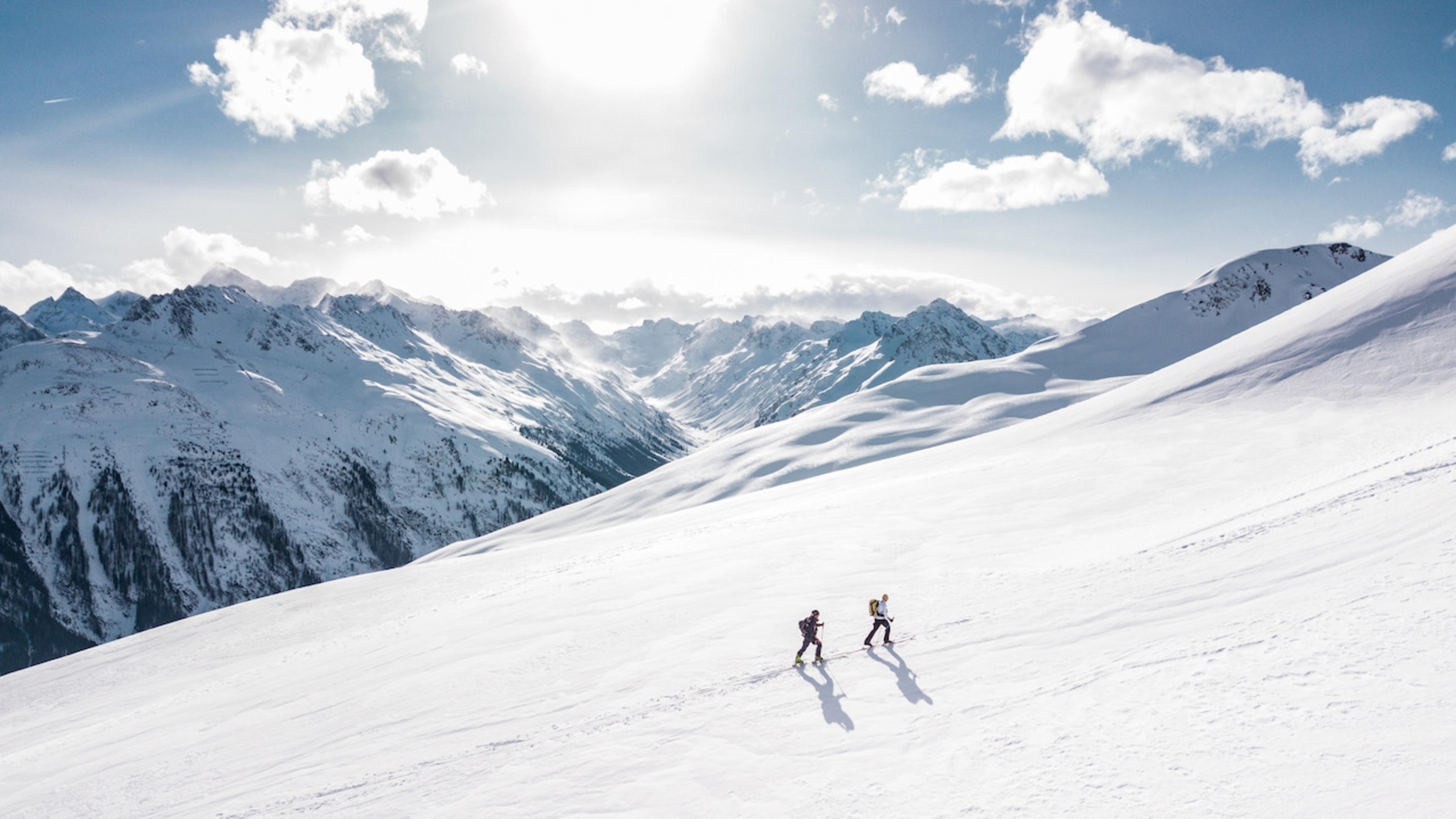 Two men hiking on snow mountain