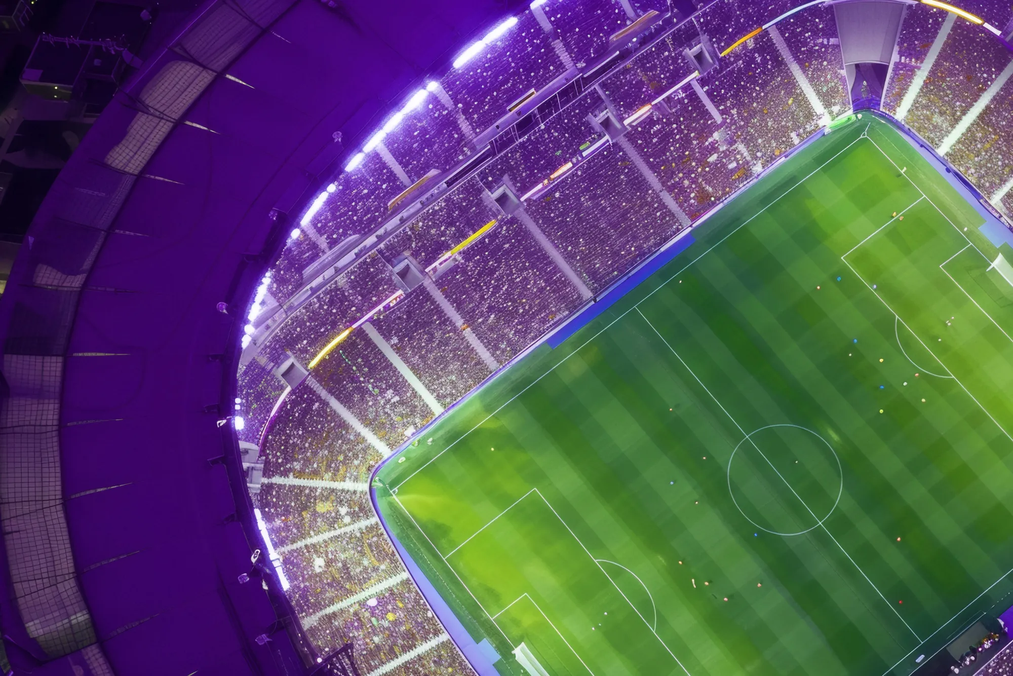 En upplyst fotbollsstadion fylld med åskådare i publiken runtomkring fotbollsplanen. 