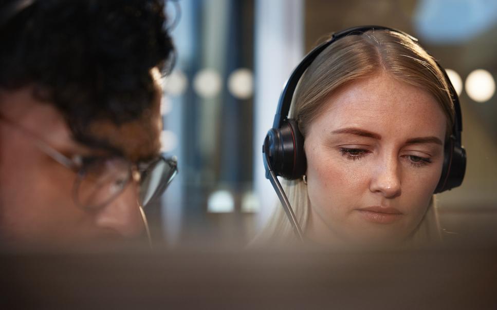 Customer service representatives with headsets